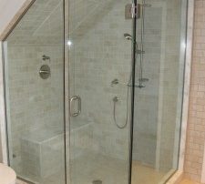 Corner steam shower with slanted ceiling